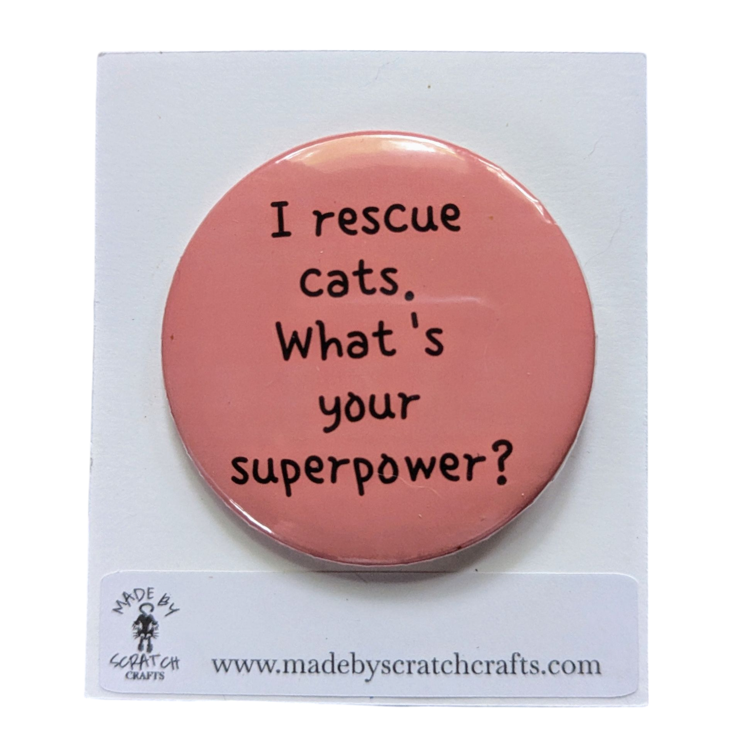 Pink button badge with text 'I rescue cats. What's your superpower?' on a white background