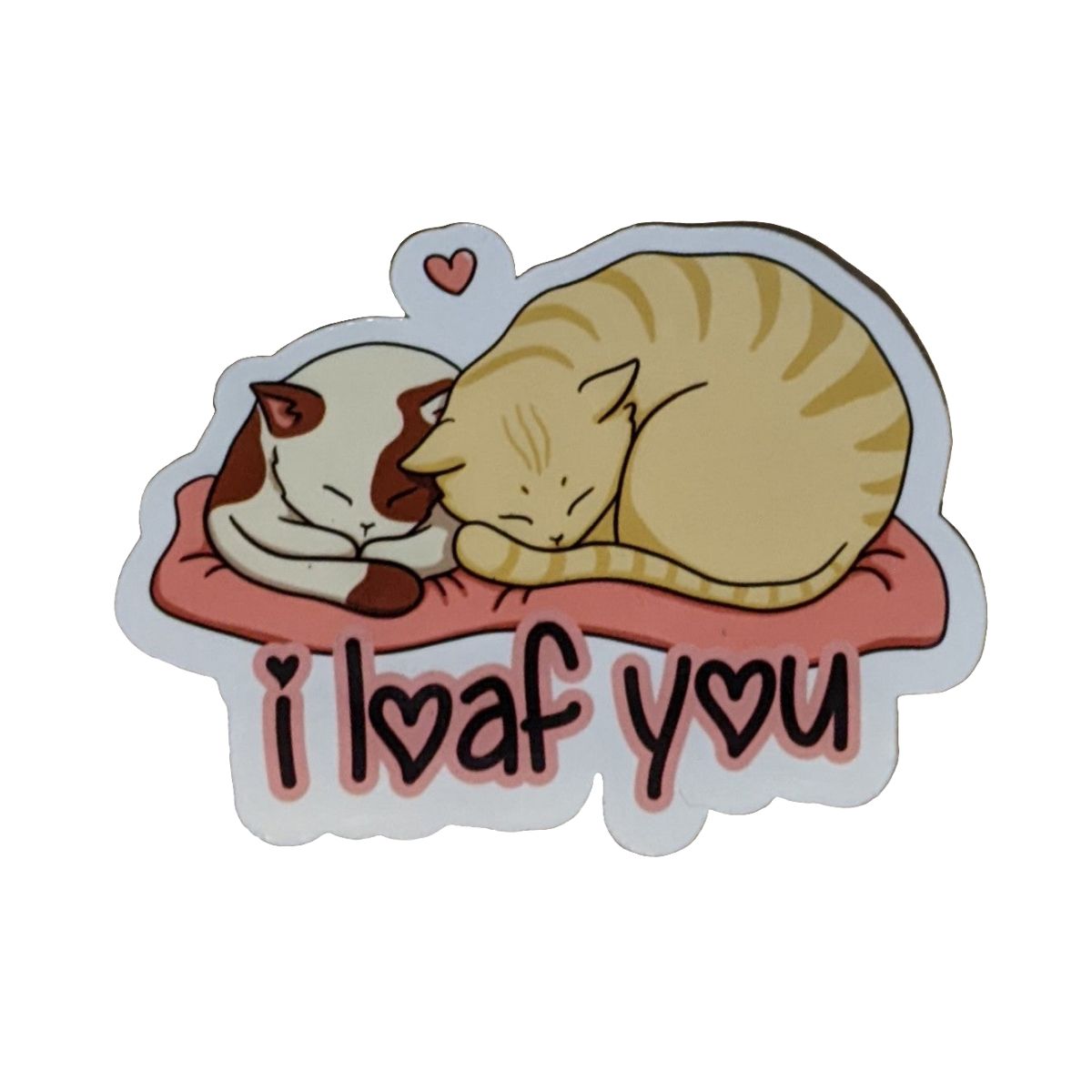 Sticker with two cats sleeping on a heart-shaped pillow and 'I loaf you' text.