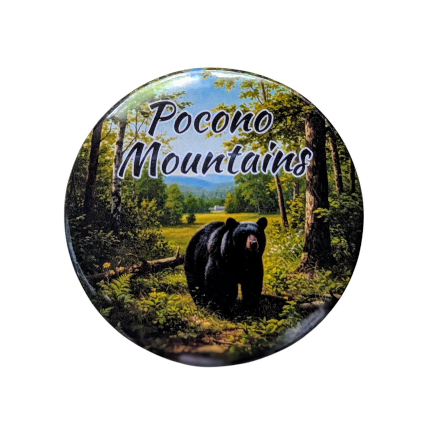 Round magnet with a bear in a forest and 'Pocono Mountains' text on a white background