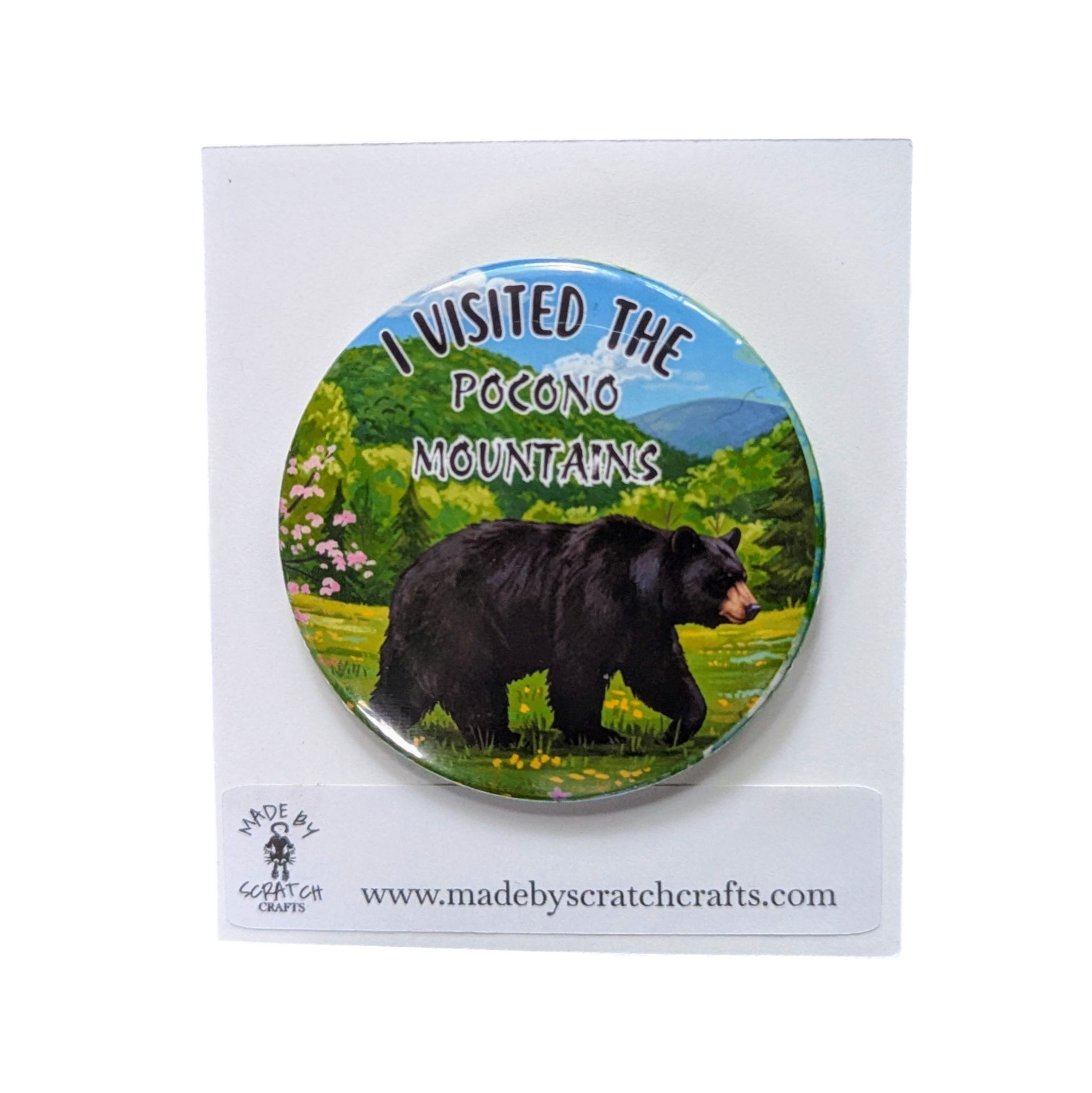 Button badge with bear illustration and text 'I visited the Pocono Mountains' on a scenic background, featuring the brand 'Made by Scratch Crafts'.