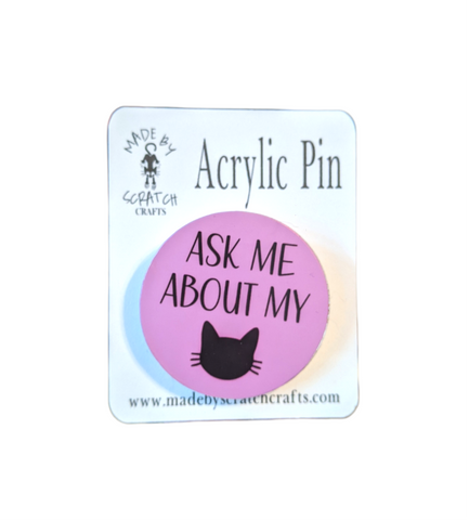 Ask Me About My Cat Acrylic Pin: Express your love for your feline friend with this round acrylic lapel pin. Measuring 1.5 inches in diameter, pin it to your clothes, backpack, or hat to proudly proclaim your cat obsession. Just kidding, don't pin it to your cat's collar! Be prepared for people to stop and ask about your cat when they see this pin.