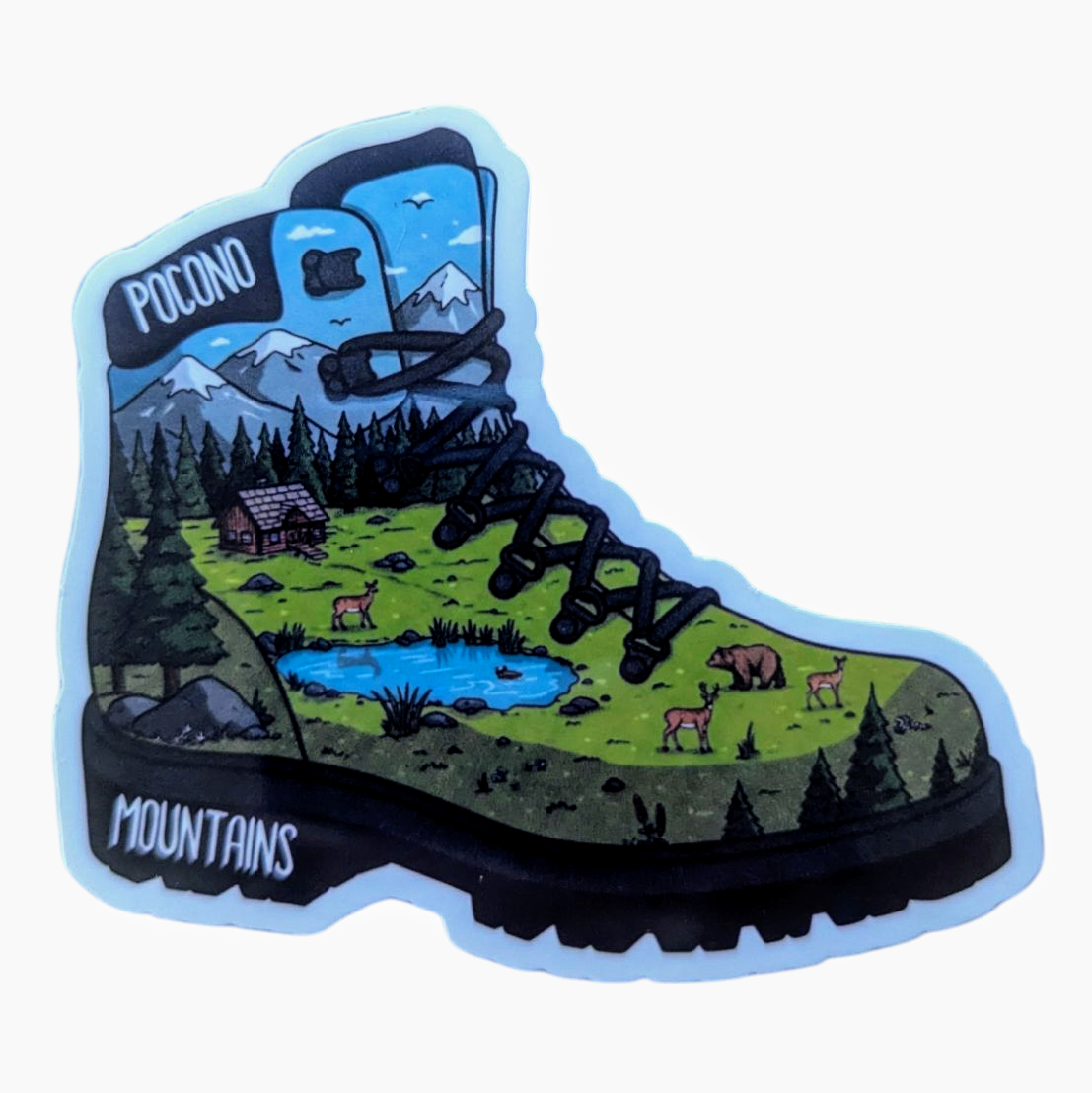A vinyl sticker in the shape of a hiking boot with a scenic view of Pocono Mountains, including a cabin, pond, deer, and a bear.