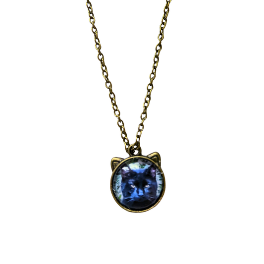 Necklace with cat ears that hods a  a photo of a cat pendant on a white background