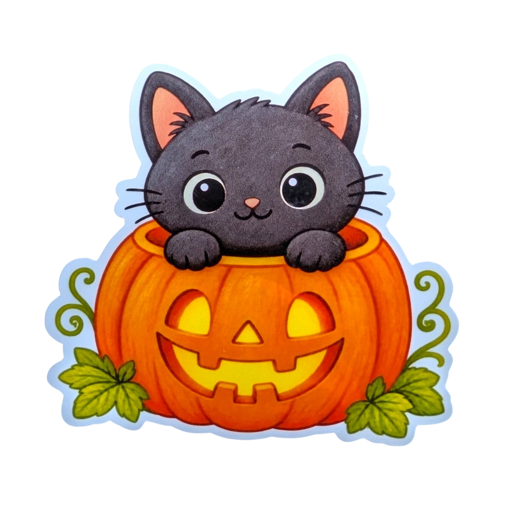 A die-cut sticker featuring a cute cartoon black cat peeking out of a carved orange pumpkin with green leaves, shown on a plain white background.