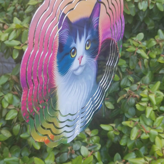 8-inch Cat Wind Spinner: Enhance your outdoor space with the captivating 8-inch Cat Wind Spinner! This beautiful spinner showcases a colorful design of a black and white fluffy cat against a backdrop of vibrant sky and flowers. Made of double-sided aluminum, it includes a convenient hook for easy installation. Perfect for gardens or porches, this charming piece is sure to delight any cat enthusiast!