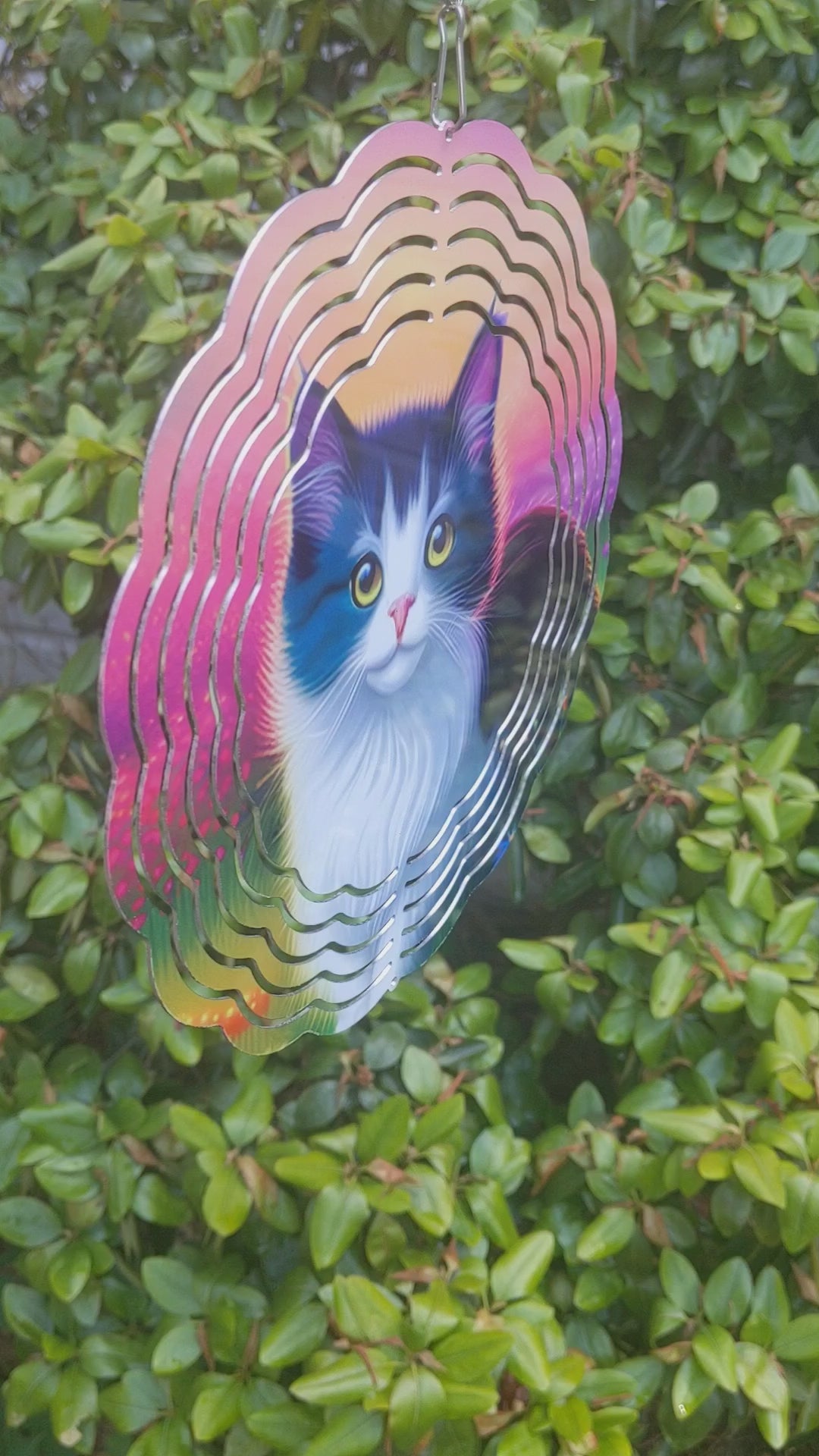 8-inch Cat Wind Spinner: Enhance your outdoor space with the captivating 8-inch Cat Wind Spinner! This beautiful spinner showcases a colorful design of a black and white fluffy cat against a backdrop of vibrant sky and flowers. Made of double-sided aluminum, it includes a convenient hook for easy installation. Perfect for gardens or porches, this charming piece is sure to delight any cat enthusiast!