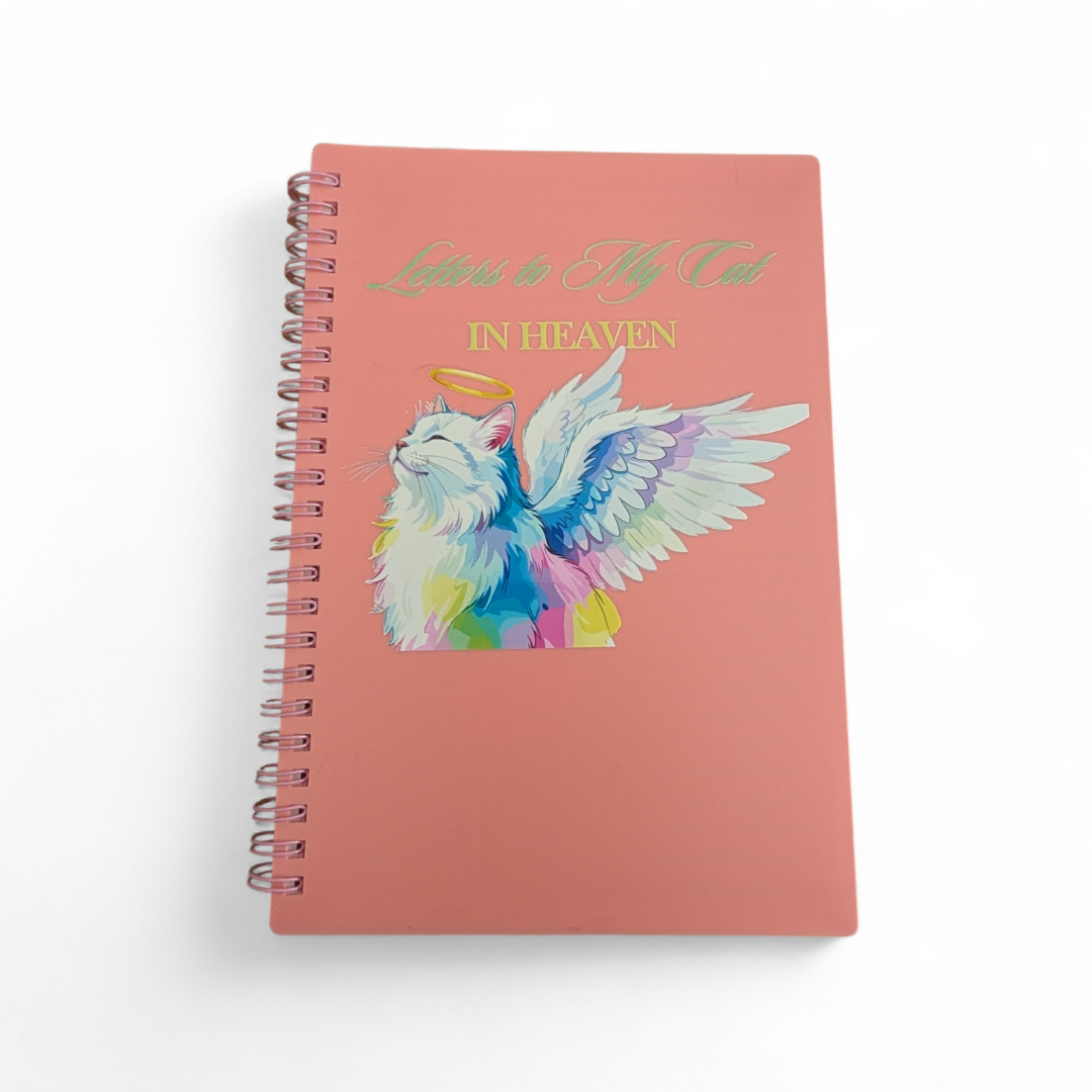 Notebook with a colorful angel illustration on a pink cover