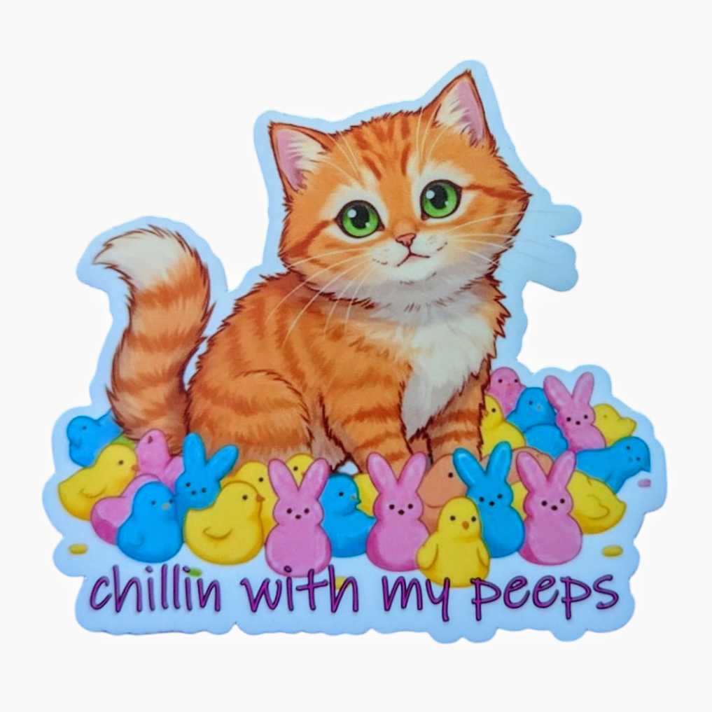 Orange tabby cat sticker surrounded by colorful peep candies that says "Chillin with my peeps" on a white background.