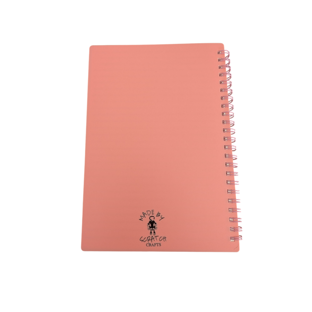 Pink notebook with a brand logo on a white background