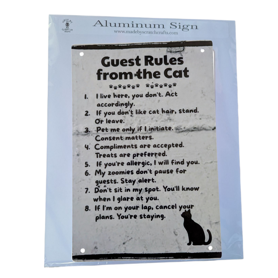 Aluminum sign with 'Guest Rules from the Cat' text on a gray background