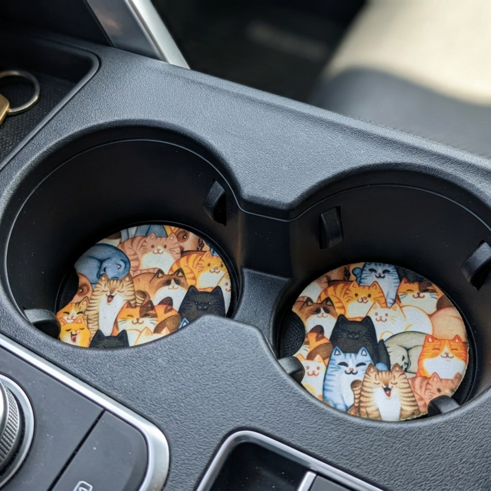 Cat-themed coasters in a car cup holder