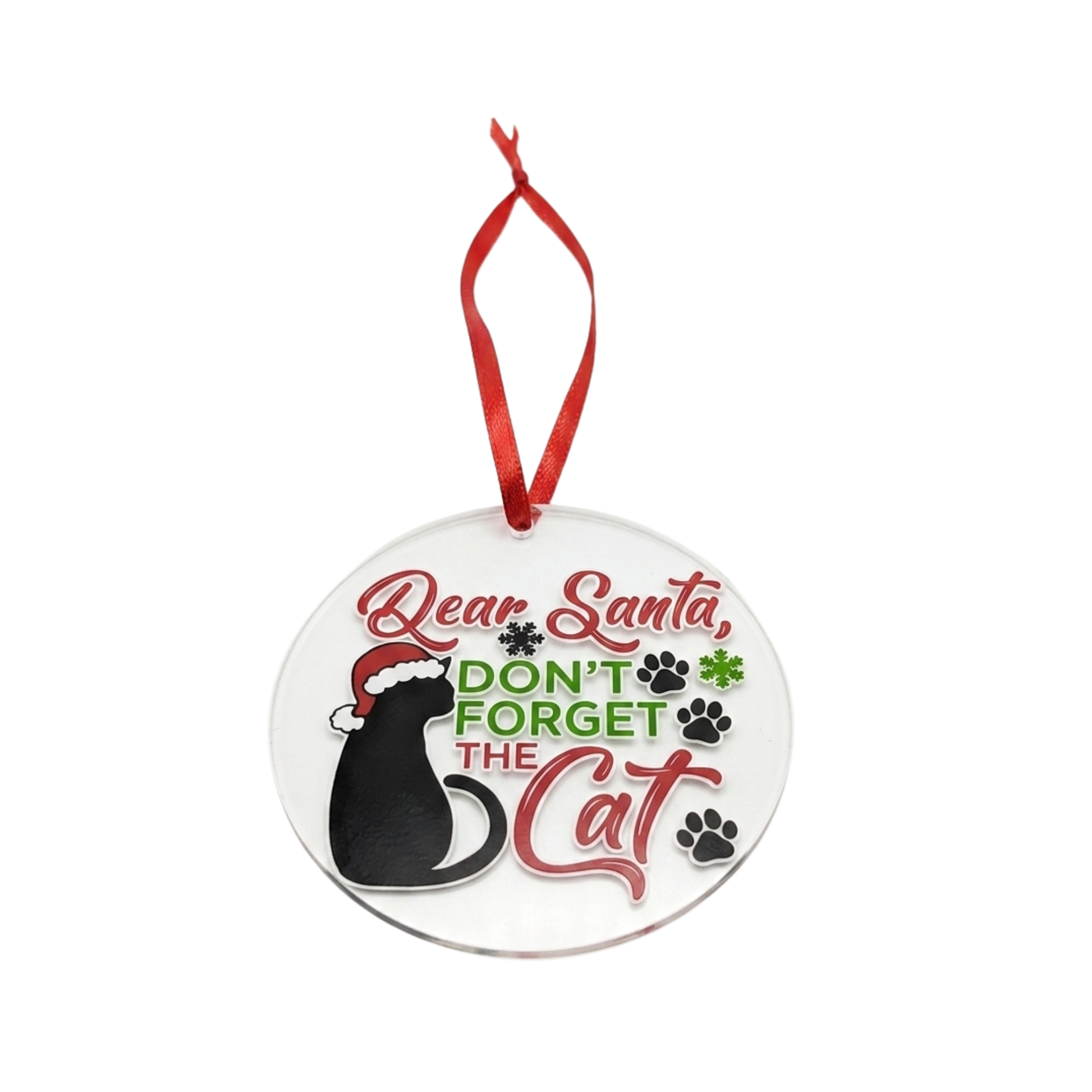 A round clear acrylic Christmas ornament featuring a black cat wearing a red Santa hat and the text 'Dear Santa, DON'T FORGET THE Cat' in red and green lettering, with paw prints and a red hanging ribbon.