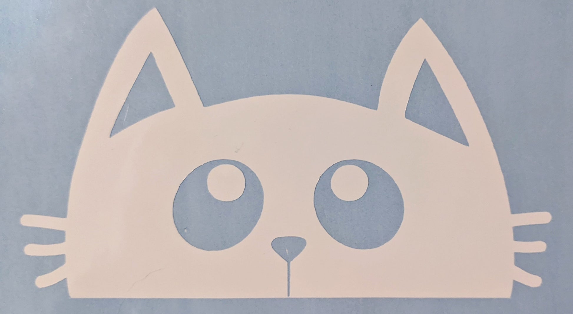 White peeking cat vinyl car decal on blue backing