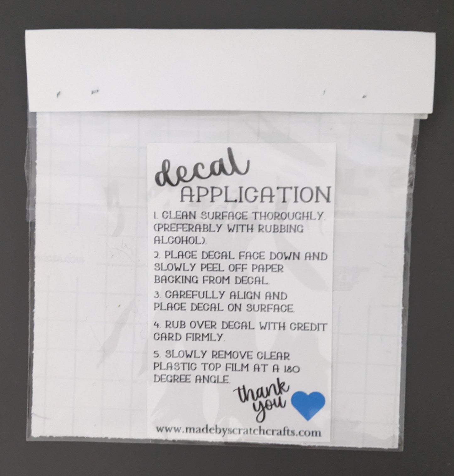 cat heart vinyl car decal packaged with application instructions